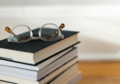 Glasses on a stack of books